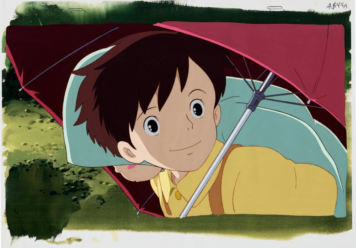 Production cel of Kanta under a red umbrella from My Neighbor Totoro, over a painted background whose green wash runs past the frame